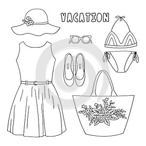 Fashionable summer women`s wardrobe.Set of clothes and accessories in doodle style.