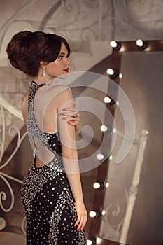 Fashionable teen girl on prom party. Brunette with elegant hairs