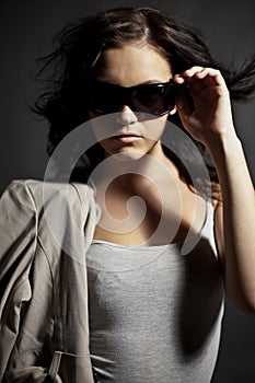 Fashionable teen in sunglasses photo