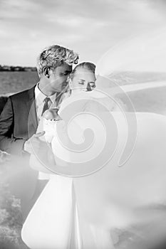 Fashionable wedding couple. Bride and Groom. Black and white photography. Outdoor portrait