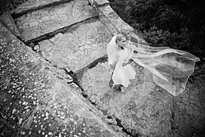 Fashionable wedding couple. Bride and Groom. Black and white photography. Outdoor portrait