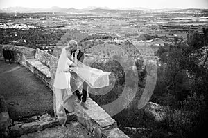 Fashionable wedding couple. Bride and Groom. Black and white photography. Outdoor portrait