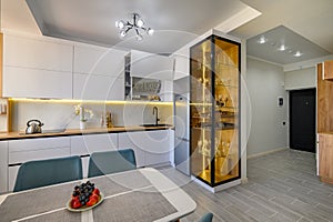 A fashionable white studio with a modern kitchen