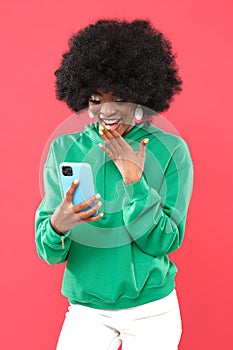 Fashionable woman with  afro hair wearing colorful clothes. Beauty ethnics.