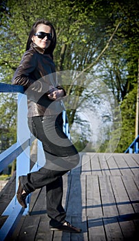 Fashionable woman on bridge