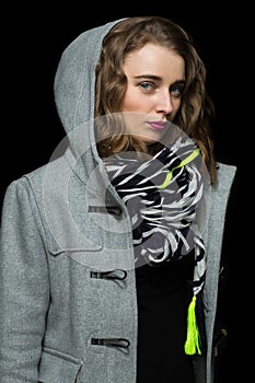 Fashionable woman in a grey hooded coat
