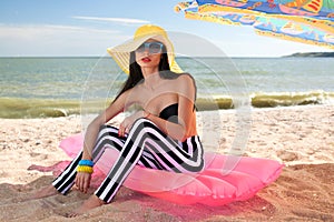 Fashionable woman in stylish swimsuit