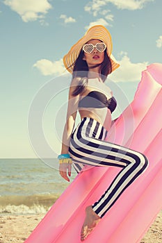 Fashionable woman in stylish swimsuit