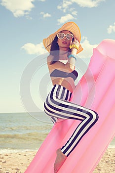 Fashionable woman in stylish swimsuit
