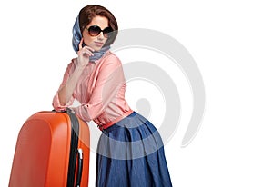 Fashionable woman with a suitcase travel