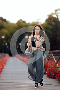 Fashionable Woman in Turkish Style Outfit on The Bridge of Desires