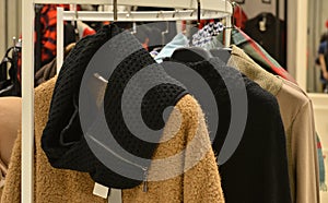 Fashionable women dress on hangers in clothing shop,dress close up