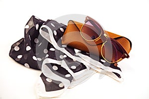 fashionable women's sunglasses. A case for storing glasses. they are lying on a