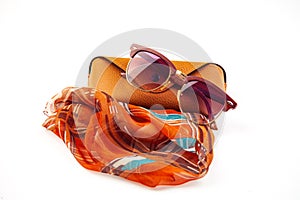 fashionable women's sunglasses. A case for storing glasses. they are lying on a