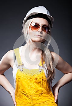 Fashionable young architect woman, construction worker