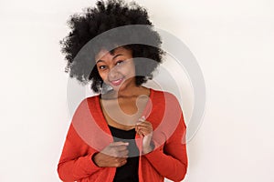 Fashionable young black woman in red sweater smiling