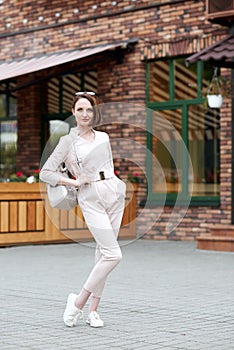 Fashionable young girl posing in the street