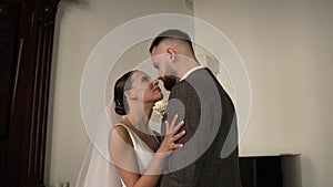 Fashionable young wedding couple in a park