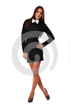 Fashionable young woman in black mini dress with white bowtie