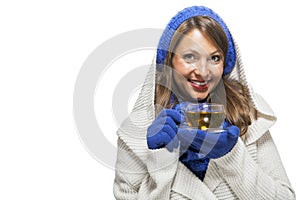 Fashionable young woman in a blue knitted winter ensemble