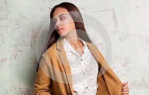 Fashionable young woman in studio.