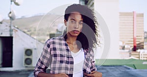 Fashionable young woman on urban rooftop