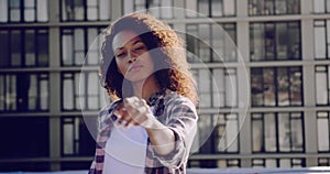 Fashionable young woman on urban rooftop