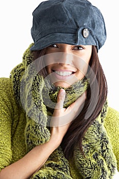 Fashionable Young Woman Wearing Knitwear In Studio photo