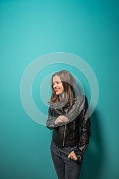 Fashioned girl in leather jacket in dark glasses