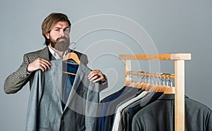Fashioner man designing formal clothes premium quality, classic wardrobe concept photo