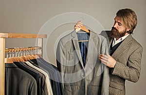 Fashioner man designing formal clothes premium quality, vintage piece concept photo