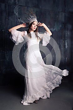 Fasionable woman in white crown