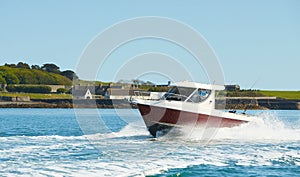 Fast boat on wavy blue sea. luxury motor boat in navigation