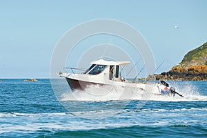 Fast boat on wavy blue sea. luxury motor boat in navigation