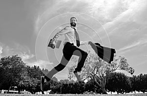 Fast business concept. Running businessman ready to run jump and sprint.