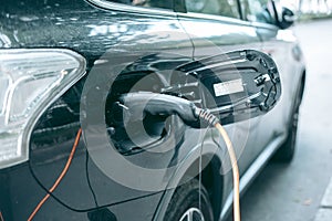 Fast charging electric car in the city photo