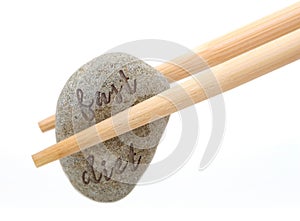 Fast diet concept chopstick with stone