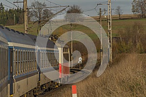 Fast electric train with coaches from Brno to Plzen in spring morning