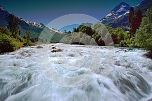 Fast flowing Oldeeiva river in flood