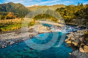 Rapids in the Hokitika River near the Hokitika Gorge carpark on the South Island West Coast withe the Southern alps