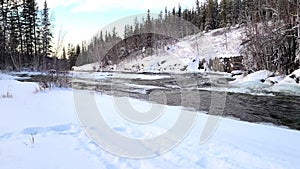 Fast flowing river that`s starting to freeze