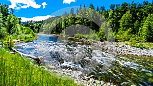 The fast flowing water of the Coldwater River near the intersection between the Coldwater Road and the Coquihalla Highway