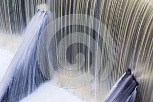 Fast flowing water over a concrete dam, California; long exposure