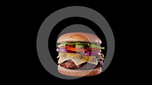 Fast food burger spinning, with ingredient catapulted on top - alpha channel included
