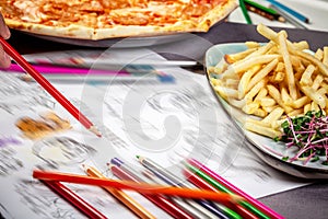 Fast food concept. french fries and pizza. children`s menu in the restaurant, the food that children love to eat