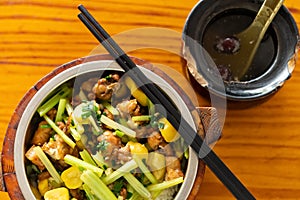 fast food of fried chicken with chestnut and celery with bowl of soup horizontal composition