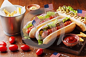 Fast food from hot dog with sausage and fries decorated USA flag on 4th july. Table setting on american independence day.