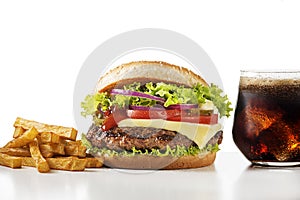 Fast food meal with hamburger, potato fries and cola drink