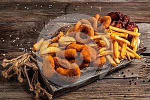Fast food products fried chicken with french fries and nuggets meal, junk food and unhealthy food. place for text, top view