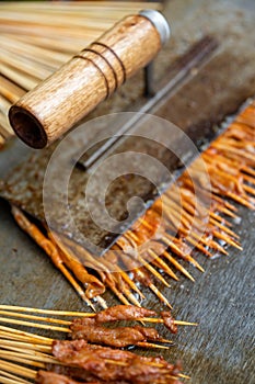 Fast food on sticks cooked on a chinese street market